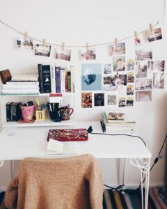 home office with photos strung up